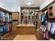 Large walk-in closet with ample shelving and storage at 11571 E Cochise Dr, Scottsdale, AZ 85259