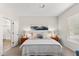 Bright bedroom with a queen-size bed, neutral decor, and large windows at 12808 W Nogales Dr, Sun City West, AZ 85375