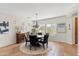 Cozy dining room featuring a round table, chandelier, and lots of natural light at 12808 W Nogales Dr, Sun City West, AZ 85375
