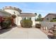 Home front exterior featuring a charming courtyard entrance and desert landscaping at 12808 W Nogales Dr, Sun City West, AZ 85375