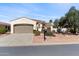 Charming single-story home with a two car garage and well-maintained desert landscaping at 12808 W Nogales Dr, Sun City West, AZ 85375