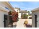 Beautiful home exterior with a courtyard entrance and lush bougainvillea at 12808 W Nogales Dr, Sun City West, AZ 85375