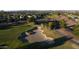 Aerial shot of golf course showing sand trap and surrounding neighborhood at 12808 W Nogales Dr, Sun City West, AZ 85375