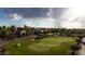 Beautiful golf course with manicured putting green surrounded by lush landscaping at 12808 W Nogales Dr, Sun City West, AZ 85375