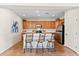 Well-equipped kitchen with stainless steel appliances, ample cabinet space, and a center island with seating at 12808 W Nogales Dr, Sun City West, AZ 85375