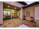 Inviting front entrance with tile flooring, bench, and decorative pots at 13359 W Baker Dr, Peoria, AZ 85383