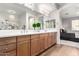 Elegant bathroom with double vanity, modern fixtures, and a large mirror at 13450 E Via Linda Dr # 2008, Scottsdale, AZ 85259