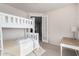 Bedroom with a bunk bed, desk, and door to another room at 13450 E Via Linda Dr # 2008, Scottsdale, AZ 85259