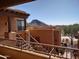 Exterior view of a two-story building with mountain views and desert landscaping at 13450 E Via Linda Dr # 2008, Scottsdale, AZ 85259