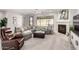 Living room features a cozy fireplace and sectional sofa at 13450 E Via Linda Dr # 2008, Scottsdale, AZ 85259