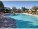Community pool with plenty of lounge chairs at 13450 E Via Linda Dr # 2008, Scottsdale, AZ 85259