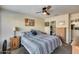 Spacious bedroom with wood floors and en-suite bathroom at 14300 W Bell Rd # 488, Surprise, AZ 85374