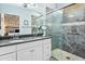 Elegant bathroom with double vanity and a walk-in shower at 15174 W Camino Estrella Dr, Surprise, AZ 85374