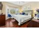 Spacious bedroom with a king-size bed and bay window at 15174 W Camino Estrella Dr, Surprise, AZ 85374