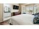 Main bedroom with en-suite bathroom and large window at 15174 W Camino Estrella Dr, Surprise, AZ 85374