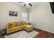 Relaxing living room with comfy sectional sofa and wood flooring at 15174 W Camino Estrella Dr, Surprise, AZ 85374