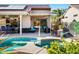 Resort style backyard with a large pool, spa, and spacious patio at 15174 W Camino Estrella Dr, Surprise, AZ 85374