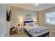 Bedroom with a queen-size bed, nightstands, and wall-mounted TV at 155 N Lakeview Blvd # 118, Chandler, AZ 85225