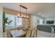 Light and airy dining room with a wood table and six chairs at 155 N Lakeview Blvd # 118, Chandler, AZ 85225