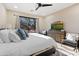 Main bedroom with king bed, large TV and access to a balcony at 19550 N Grayhawk Dr # 1101, Scottsdale, AZ 85255