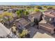 Aerial view of community, highlighting the Spanish-style architecture and landscaping at 19550 N Grayhawk Dr # 1124, Scottsdale, AZ 85255