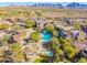 Community pool and homes with mountain views at 19550 N Grayhawk Dr # 1124, Scottsdale, AZ 85255