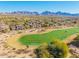 Aerial view of community with golf course and mountain backdrop at 19550 N Grayhawk Dr # 1124, Scottsdale, AZ 85255