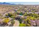 Community pool and surrounding homes with mountain views at 19550 N Grayhawk Dr # 1124, Scottsdale, AZ 85255