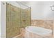 Spa-like bathroom with soaking tub and walk-in shower at 19550 N Grayhawk Dr # 1124, Scottsdale, AZ 85255