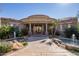 Community clubhouse entrance with water features at 19550 N Grayhawk Dr # 1124, Scottsdale, AZ 85255