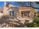 Home exterior showcasing stone accents and a covered patio at 19550 N Grayhawk Dr # 1124, Scottsdale, AZ 85255