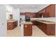 Modern kitchen featuring granite countertops and ample cabinetry at 19550 N Grayhawk Dr # 1124, Scottsdale, AZ 85255