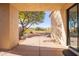 Private patio with seating area and desert landscaping at 19550 N Grayhawk Dr # 1124, Scottsdale, AZ 85255