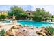 Swimming pool with a rock waterfall feature at 19550 N Grayhawk Dr # 1124, Scottsdale, AZ 85255