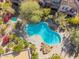 Relaxing community pool with surrounding lounge chairs at 19550 N Grayhawk Dr # 1124, Scottsdale, AZ 85255