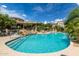 Resort-style community pool with a relaxing waterfall feature at 19550 N Grayhawk Dr # 1124, Scottsdale, AZ 85255