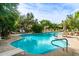 Community pool with ample seating for lounging at 19550 N Grayhawk Dr # 1124, Scottsdale, AZ 85255