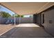 Covered patio with firepit and seating area, adjacent to a grassy yard at 2101 N Normal Ave, Tempe, AZ 85288