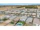 Wide aerial shot of a housing community showcasing various backyard pools, landscaping, and neighborhood streets at 22501 E Indiana Ave, Queen Creek, AZ 85142