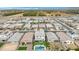 Aerial view of a housing community showcasing backyard pools, well-maintained landscaping, and suburban neighborhood design at 22501 E Indiana Ave, Queen Creek, AZ 85142