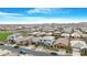 Aerial shot of a large neighborhood of single Gathering homes, mountains are visible on the horizon at 22501 E Indiana Ave, Queen Creek, AZ 85142