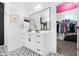 Bathroom with a sleek vanity, modern fixtures, and an open closet at 22501 E Indiana Ave, Queen Creek, AZ 85142