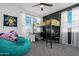 Bedroom showcasing loft bed with a desk, beanbag chair, and plenty of natural light at 22501 E Indiana Ave, Queen Creek, AZ 85142