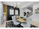 Stylish dining room with modern decor and a contemporary light fixture at 22501 E Indiana Ave, Queen Creek, AZ 85142