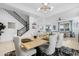 Open-concept dining room with views of the staircase and living area at 22501 E Indiana Ave, Queen Creek, AZ 85142