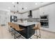 Spacious kitchen featuring a large island with seating and modern appliances at 22501 E Indiana Ave, Queen Creek, AZ 85142