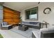 Covered outdoor patio features a comfortable seating area with modern decor at 22501 E Indiana Ave, Queen Creek, AZ 85142