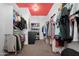 Organized walk-in closet with ample shelving and hanging space at 22501 E Indiana Ave, Queen Creek, AZ 85142