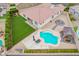 Backyard oasis with sparkling pool, grassy lawn, and covered patio at 24147 N 165Th Ln, Surprise, AZ 85387