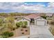 Single-story home with two-car garage and landscaped yard at 24147 N 165Th Ln, Surprise, AZ 85387